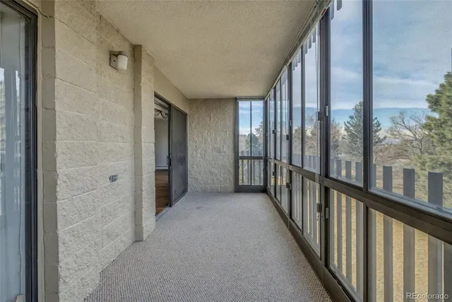 a view of a hallway with windows