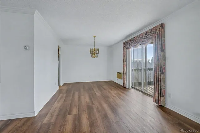 a view of hallway with wooden floor