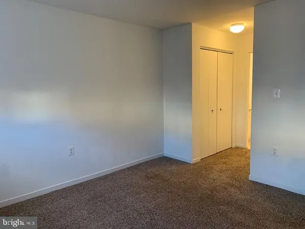 an empty room with a empty space and a window