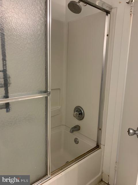 626 South Charles Street, Unit R 25 Baltimore, MD 21230 - Photo 17 of 17 a bathroom with a shower and a sink