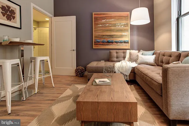 a living room with furniture and a window