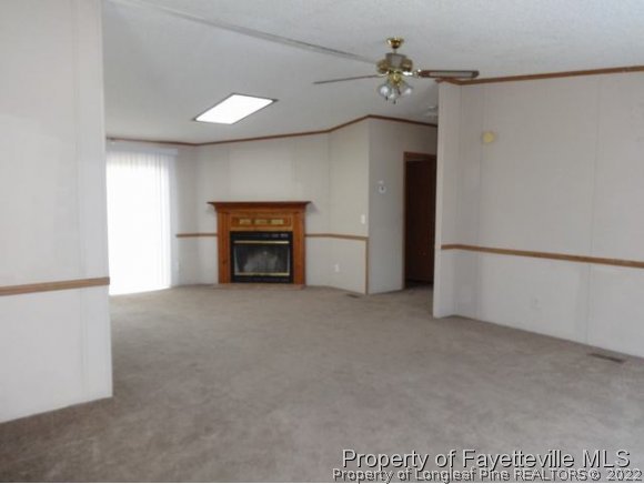 705 Winding Ridge Sanford, NC 27332 - Photo 2 of 10 a view of empty room with a fireplace