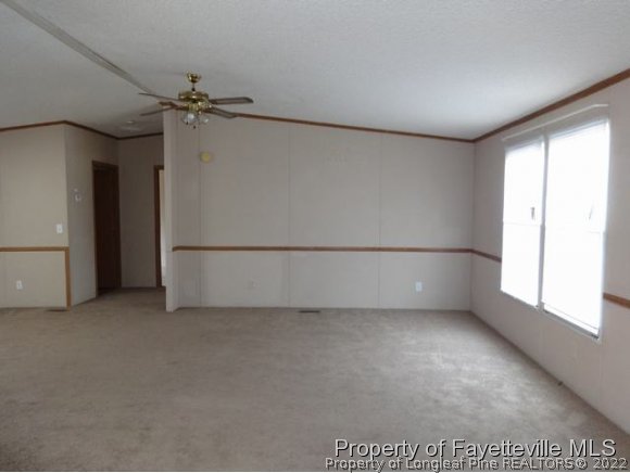 705 Winding Ridge Sanford, NC 27332 - Photo 3 of 10 an empty room with windows and closet