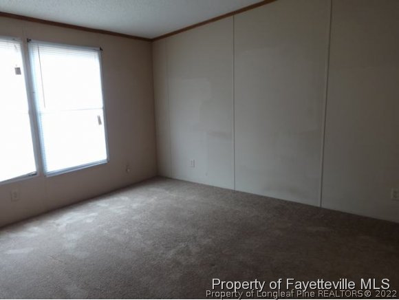 705 Winding Ridge Sanford, NC 27332 - Photo 6 of 10 an empty room with a window
