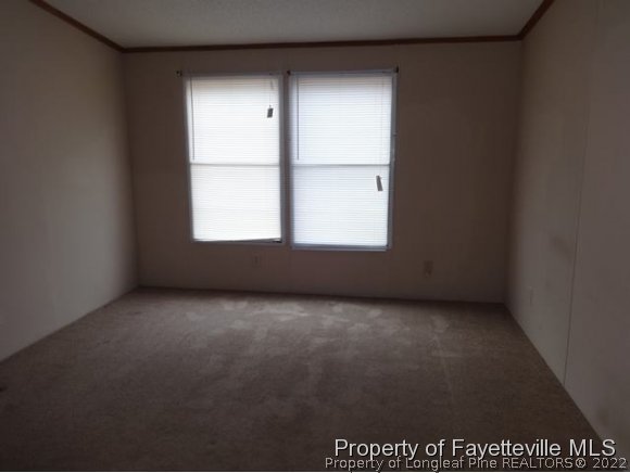 705 Winding Ridge Sanford, NC 27332 - Photo 7 of 10 an empty room with a window