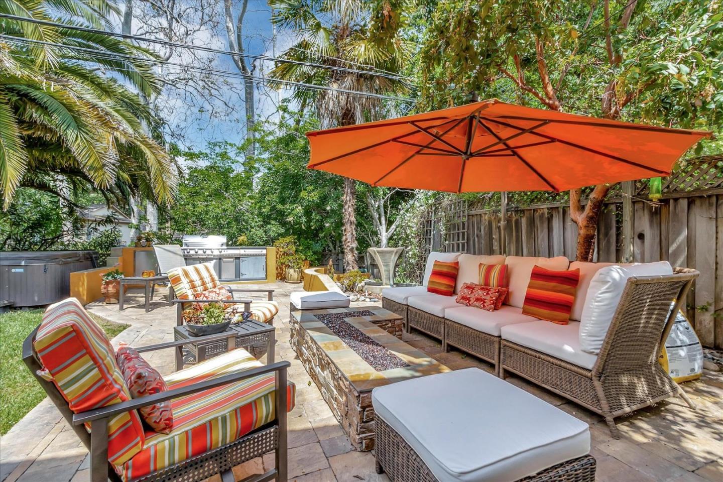 10181 Phar Lap Drive Cupertino, CA 95014 - Photo 5 of 9 an outdoor sitting area with furniture and umbrella
