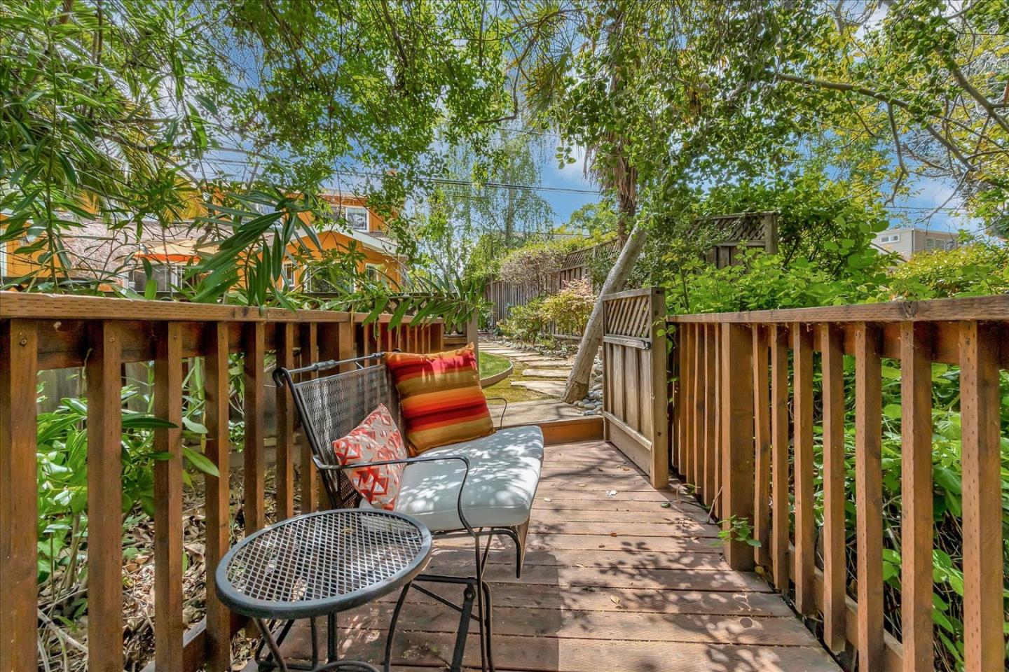 10181 Phar Lap Drive Cupertino, CA 95014 - Photo 9 of 9 a wooden bench sitting in backside of a house