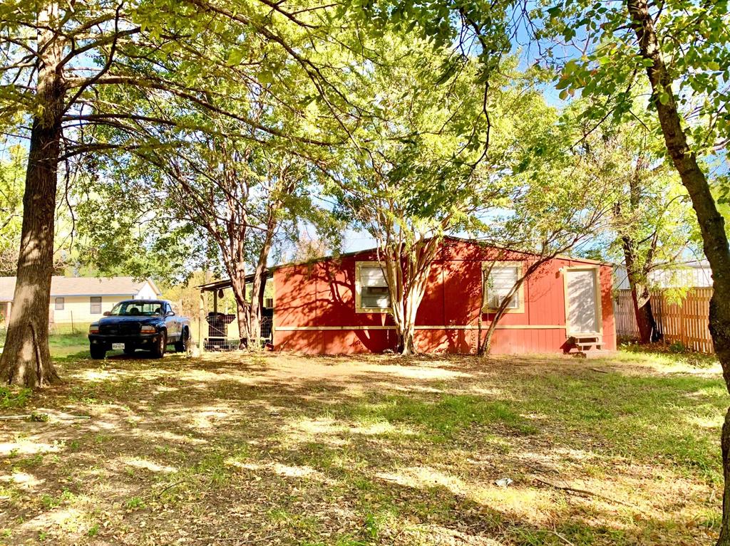 Undisclosed Address Emory, TX 75440 - Photo 2 of 11 a view of car parked in front of house with trees