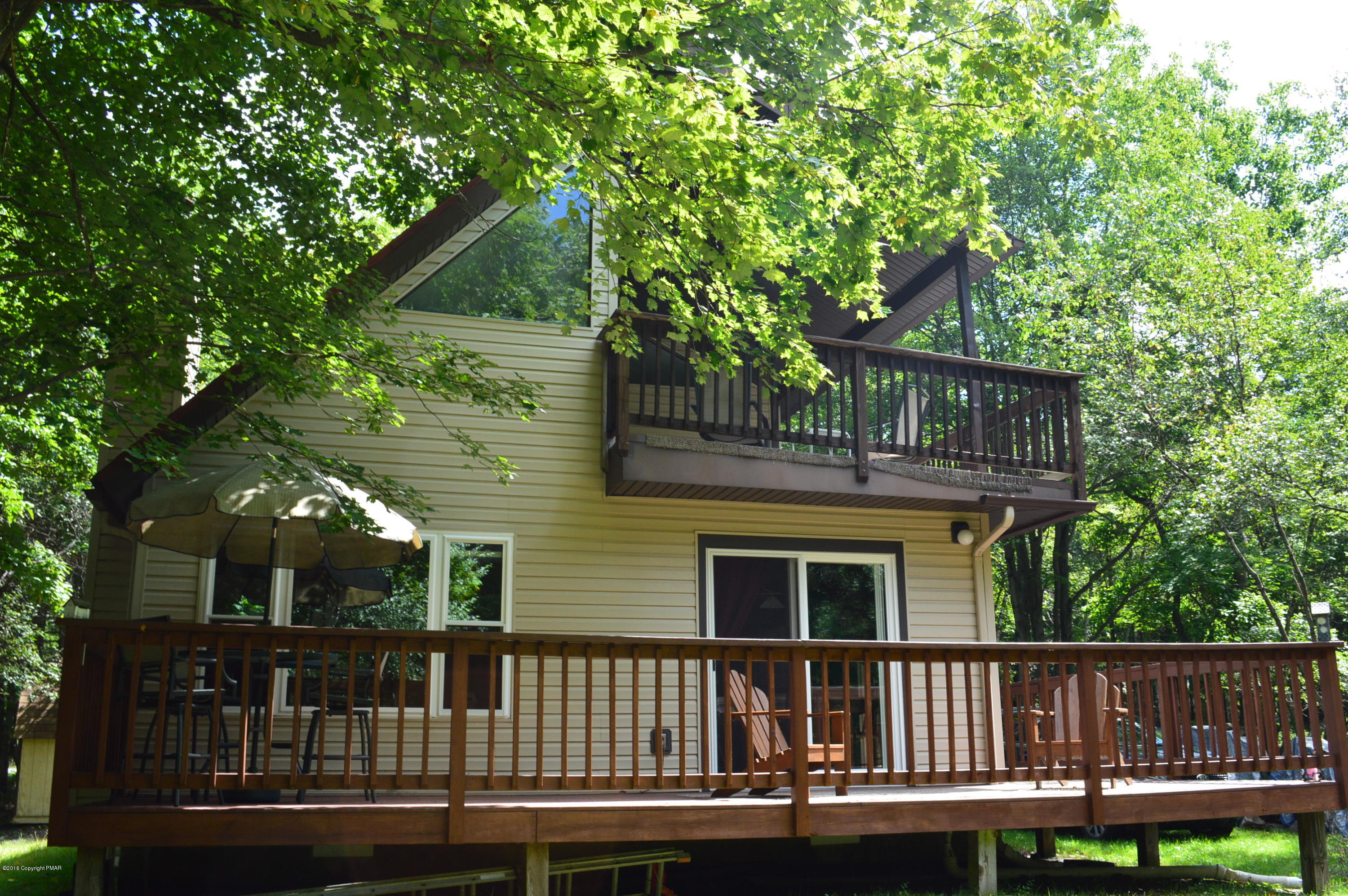 256 Fern Ridge Road Blakeslee, PA 18610 - Photo 1 of 27 a view of a house with a deck