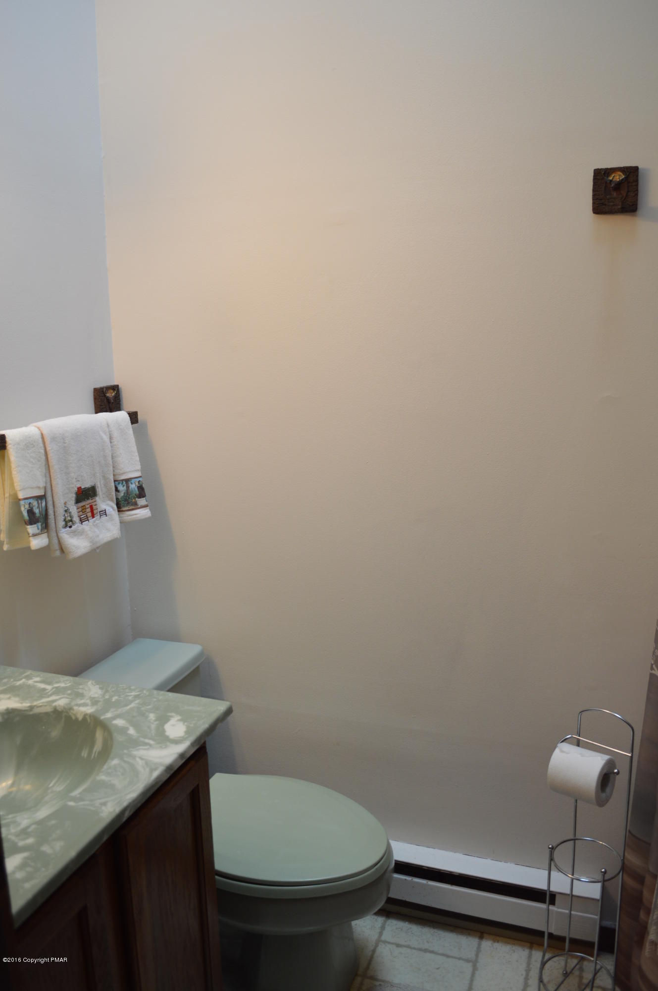 256 Fern Ridge Road Blakeslee, PA 18610 - Photo 16 of 27 a bathroom with a granite countertop toilet and a sink