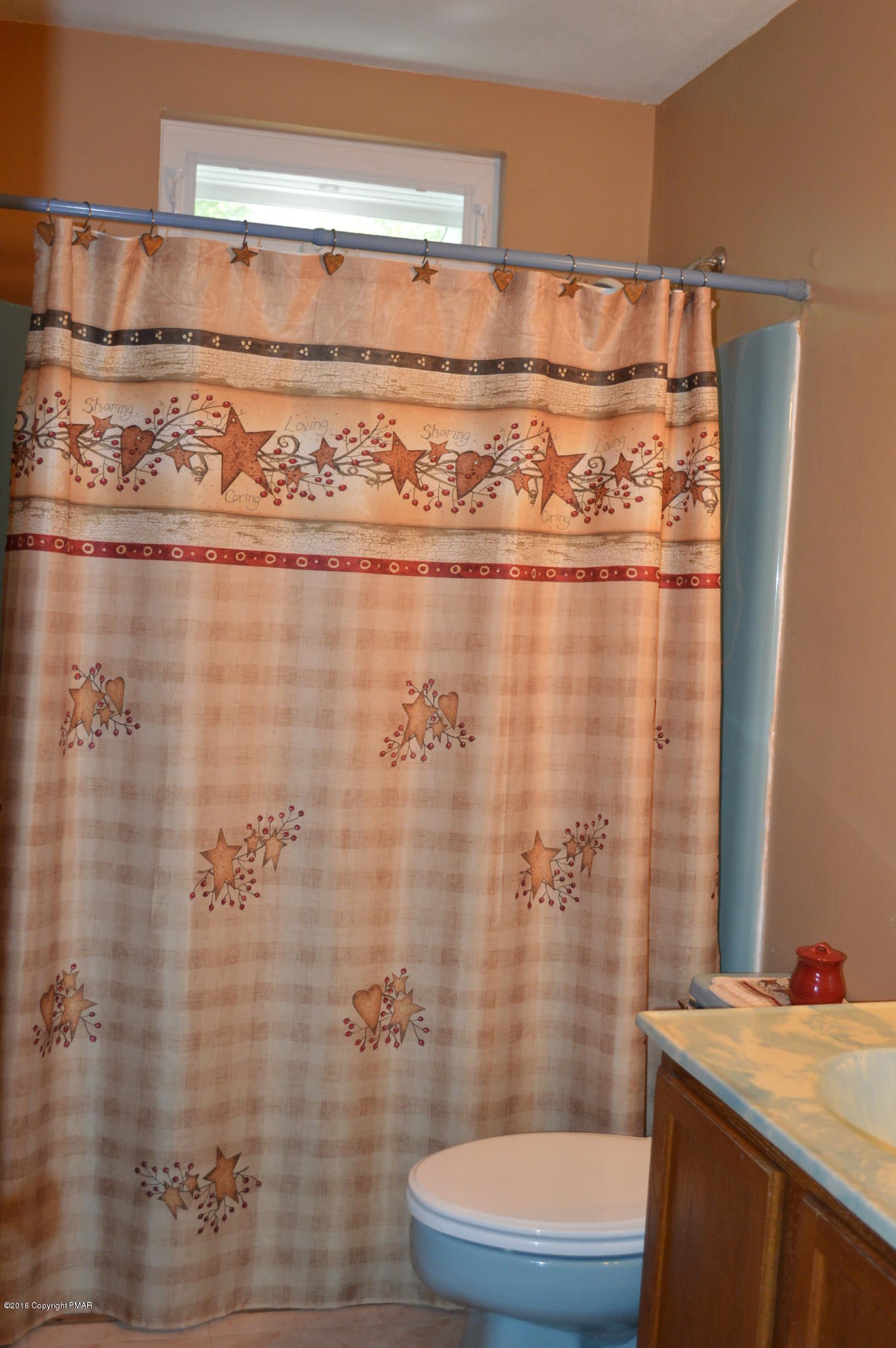 256 Fern Ridge Road Blakeslee, PA 18610 - Photo 19 of 27 a bathroom with a sink a toilet and shower