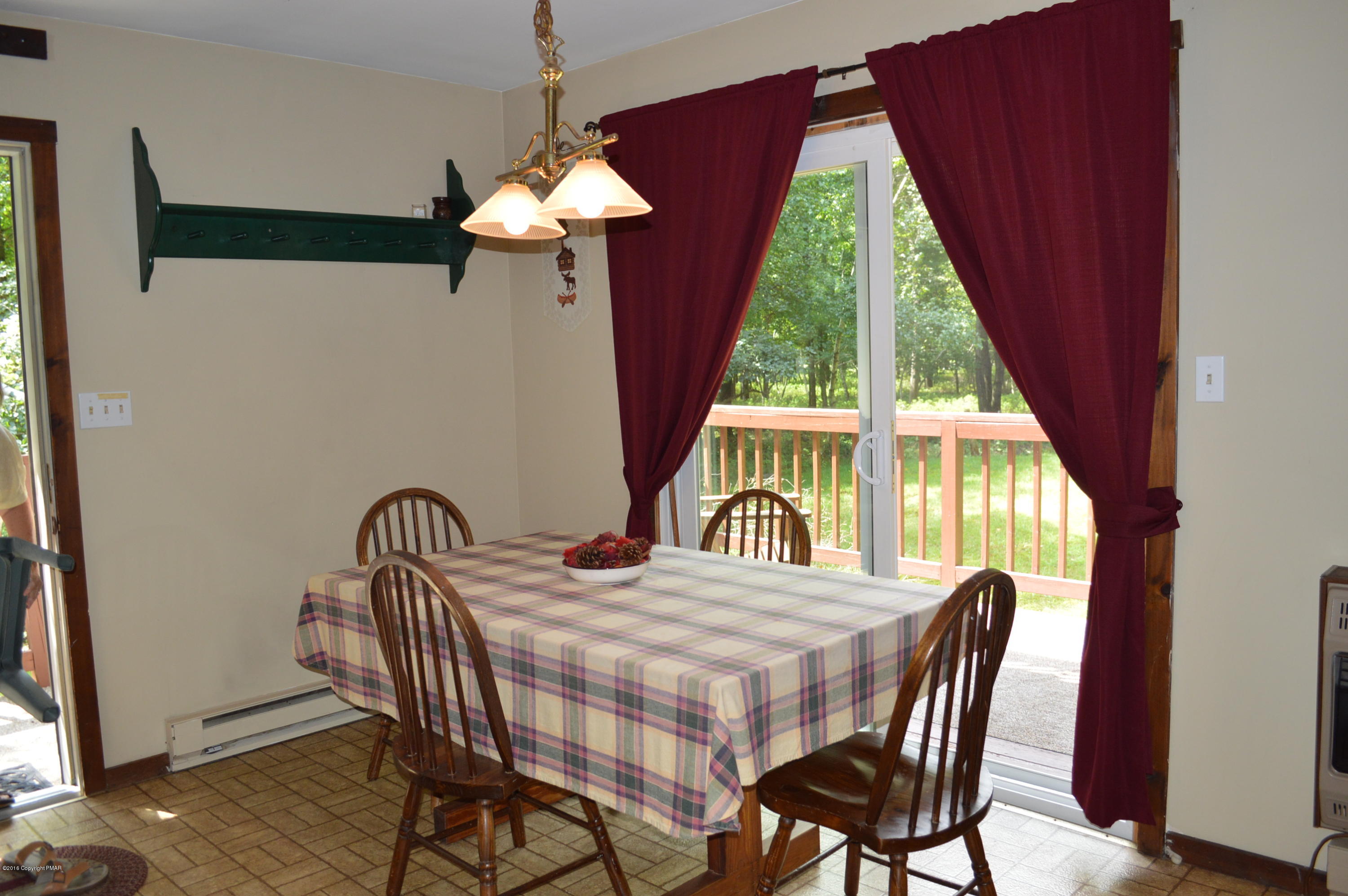 256 Fern Ridge Road Blakeslee, PA 18610 - Photo 2 of 27 a view of a dining room with furniture and window