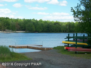 256 Fern Ridge Road Blakeslee, PA 18610 - Photo 26 of 27 a view of outdoor space with swimming pool and trees in the background