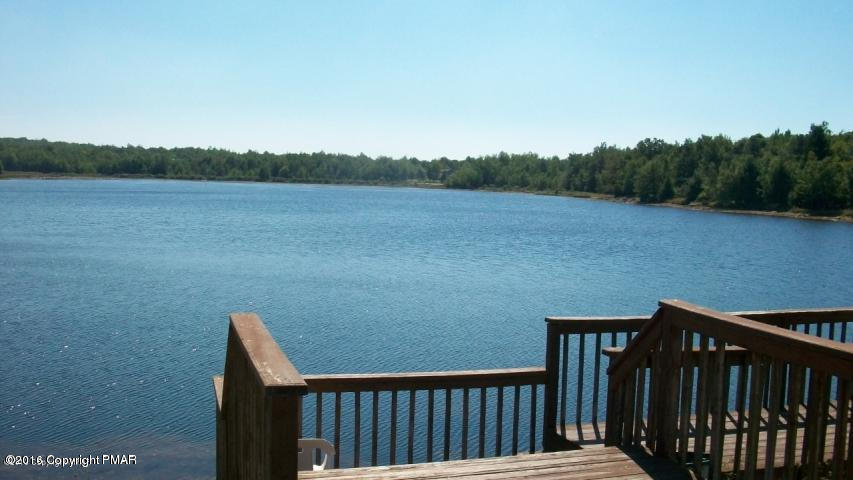 256 Fern Ridge Road Blakeslee, PA 18610 - Photo 27 of 27 a view of a balcony with wooden floor and lake view