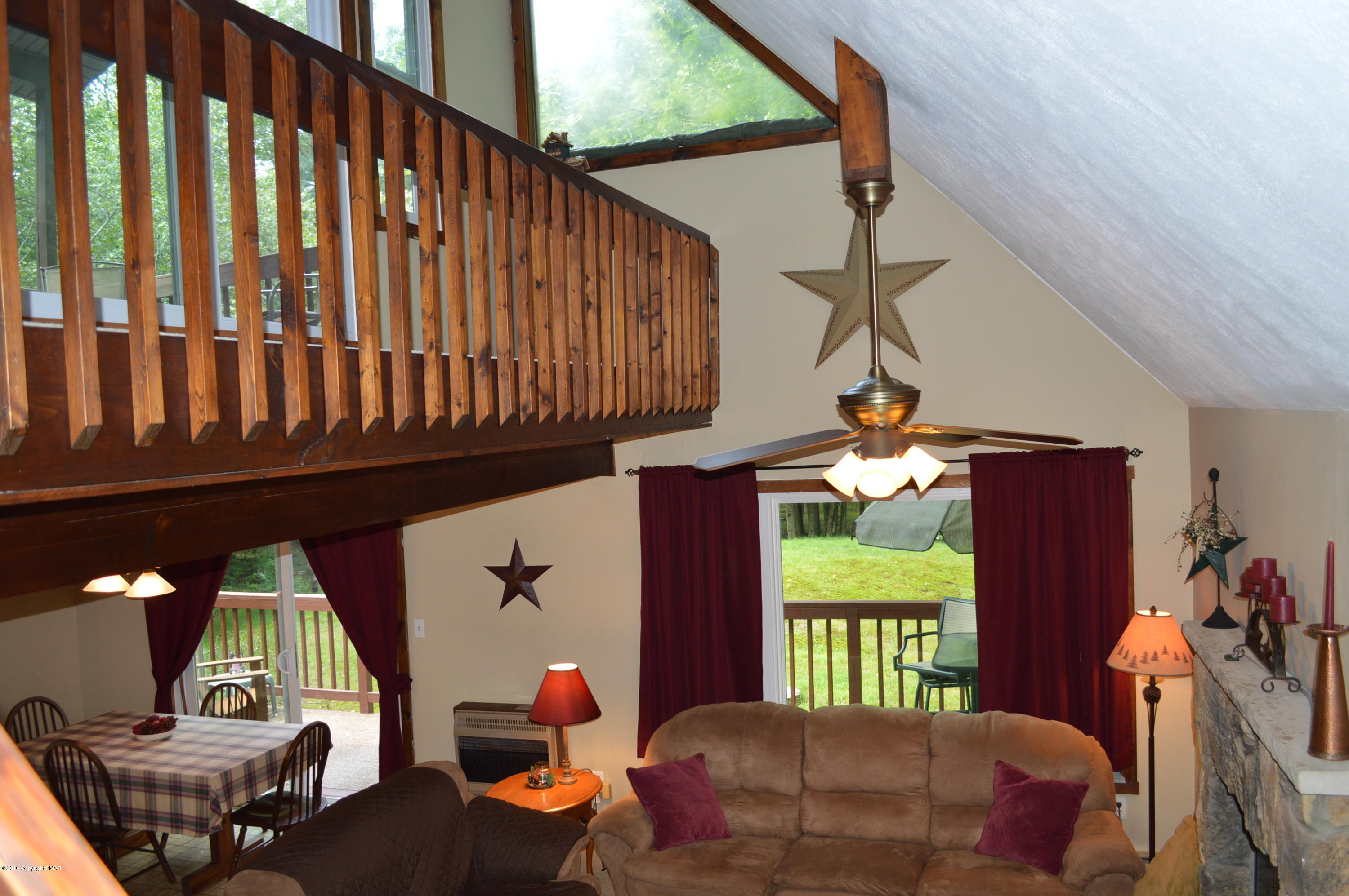 256 Fern Ridge Road Blakeslee, PA 18610 - Photo 7 of 27 a view of a porch with furniture and a porch