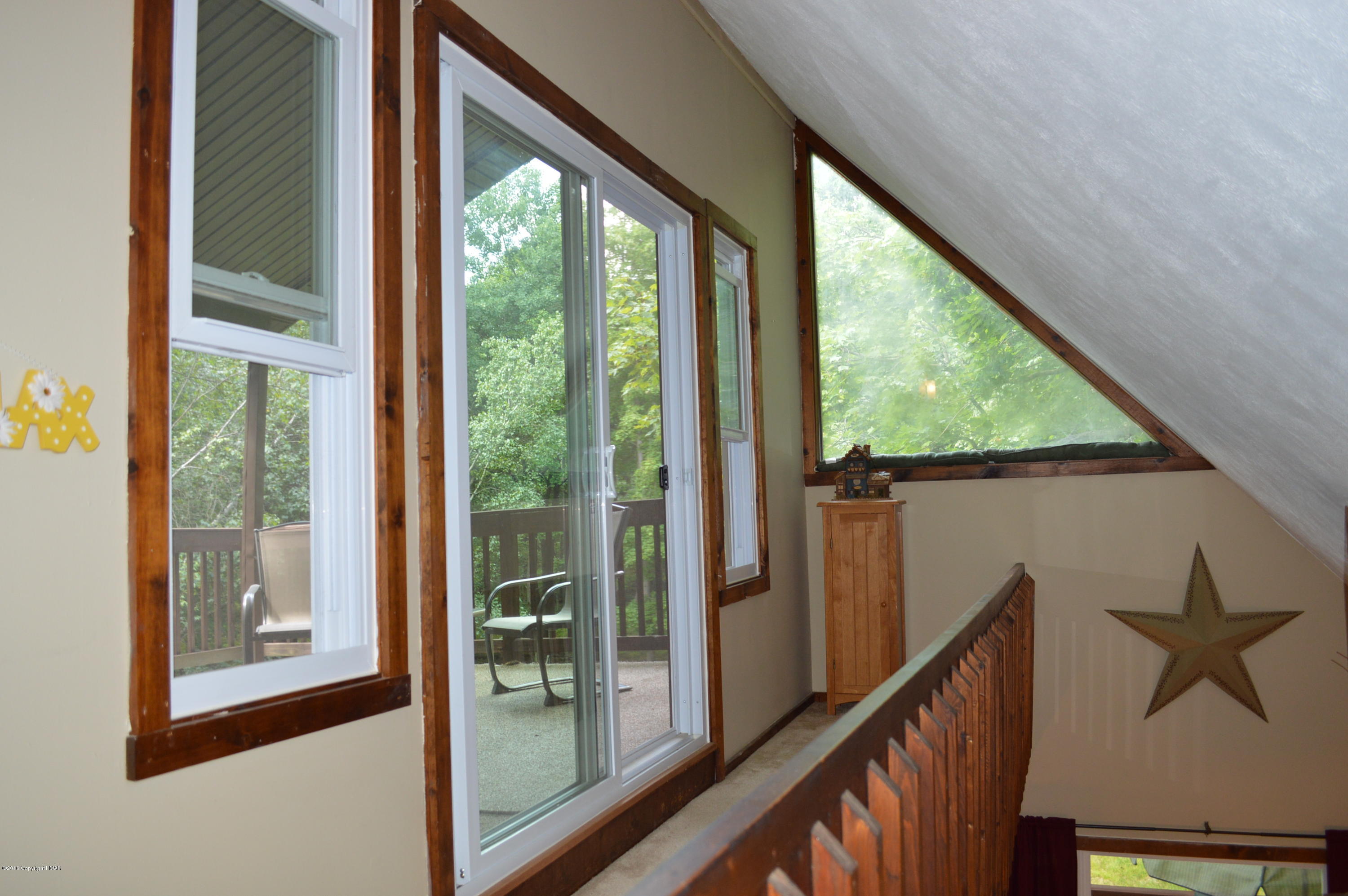 256 Fern Ridge Road Blakeslee, PA 18610 - Photo 10 of 27 a view of a balcony with furniture