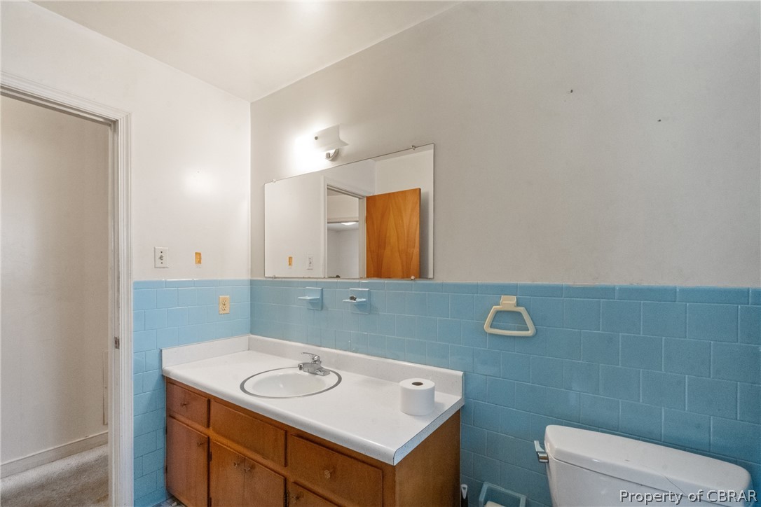 3721 Winterhaven Road Midlothian, VA 23112 - Photo 17 of 25 Bathroom with vanity, backsplash, tile walls, and toilet