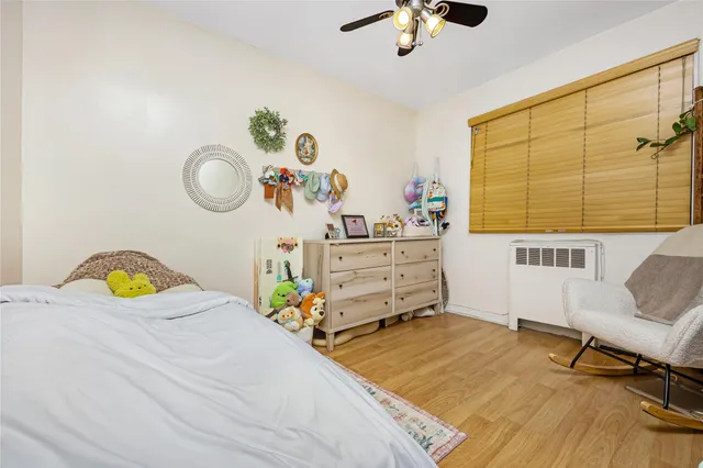 a bedroom with a bed and a chair