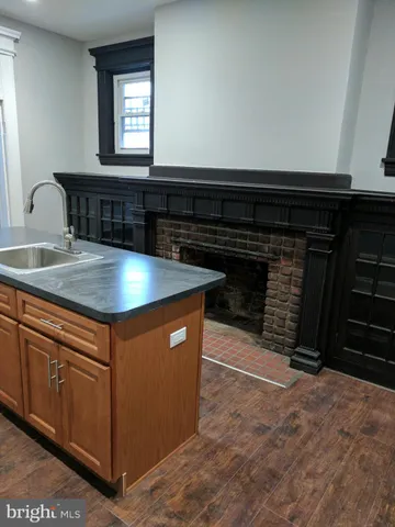 a kitchen with stainless steel appliances granite countertop a stove a sink and a granite counter tops