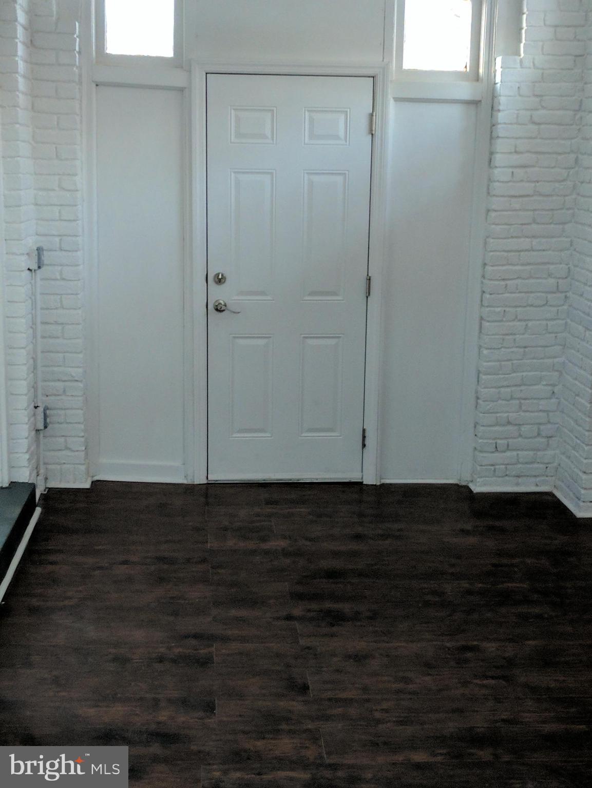 399 West State Street Trenton, NJ 08618 - Photo 8 of 28 a view of an empty room with wooden floor