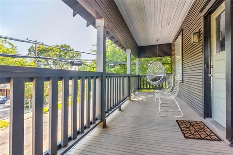 a view of porch with a furniture