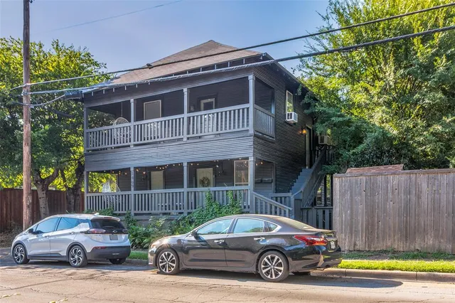 a car parked in front of a house