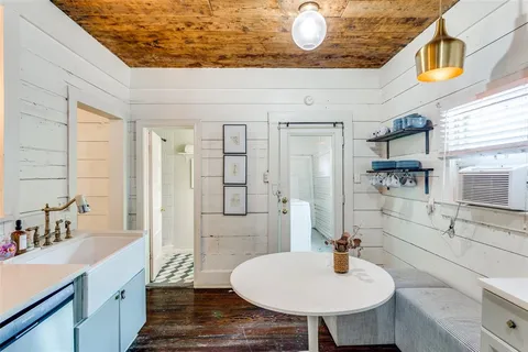 a bathroom with a sink a mirror and a bathtub