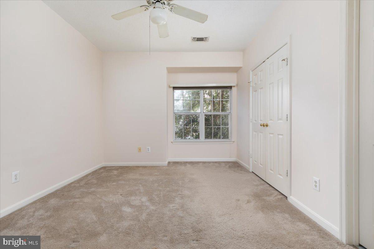 1705 Lake Shore Crest Drive, Unit 25 Reston, VA 20190 - Photo 14 of 31 an empty room with a window