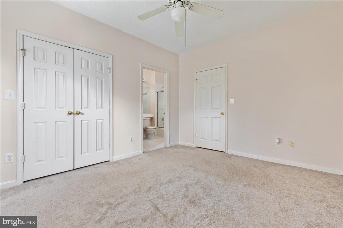 1705 Lake Shore Crest Drive, Unit 25 Reston, VA 20190 - Photo 15 of 31 an empty room with a ceiling fan