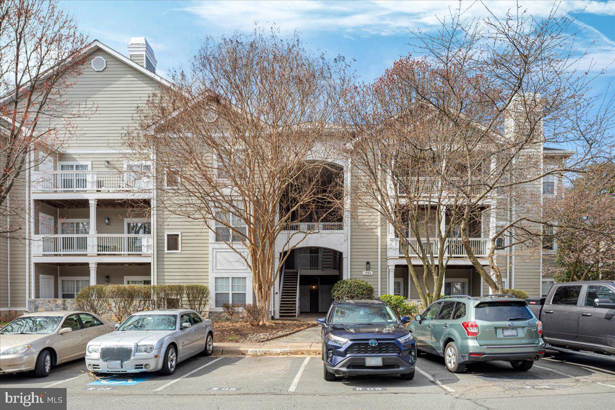 1705 Lake Shore Crest Drive, Unit 25 Reston, VA 20190 - Photo 2 of 31 a car parked in front of a building