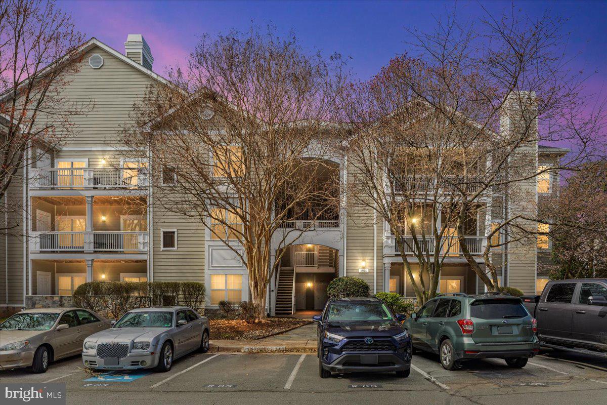 1705 Lake Shore Crest Drive, Unit 25 Reston, VA 20190 - Photo 23 of 31 a car parked in front of a building