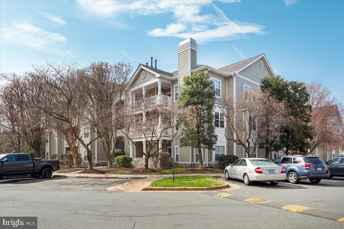 1705 Lake Shore Crest Drive, Unit 25 Reston, VA 20190 - Photo 24 of 31 a view of street with parked cars