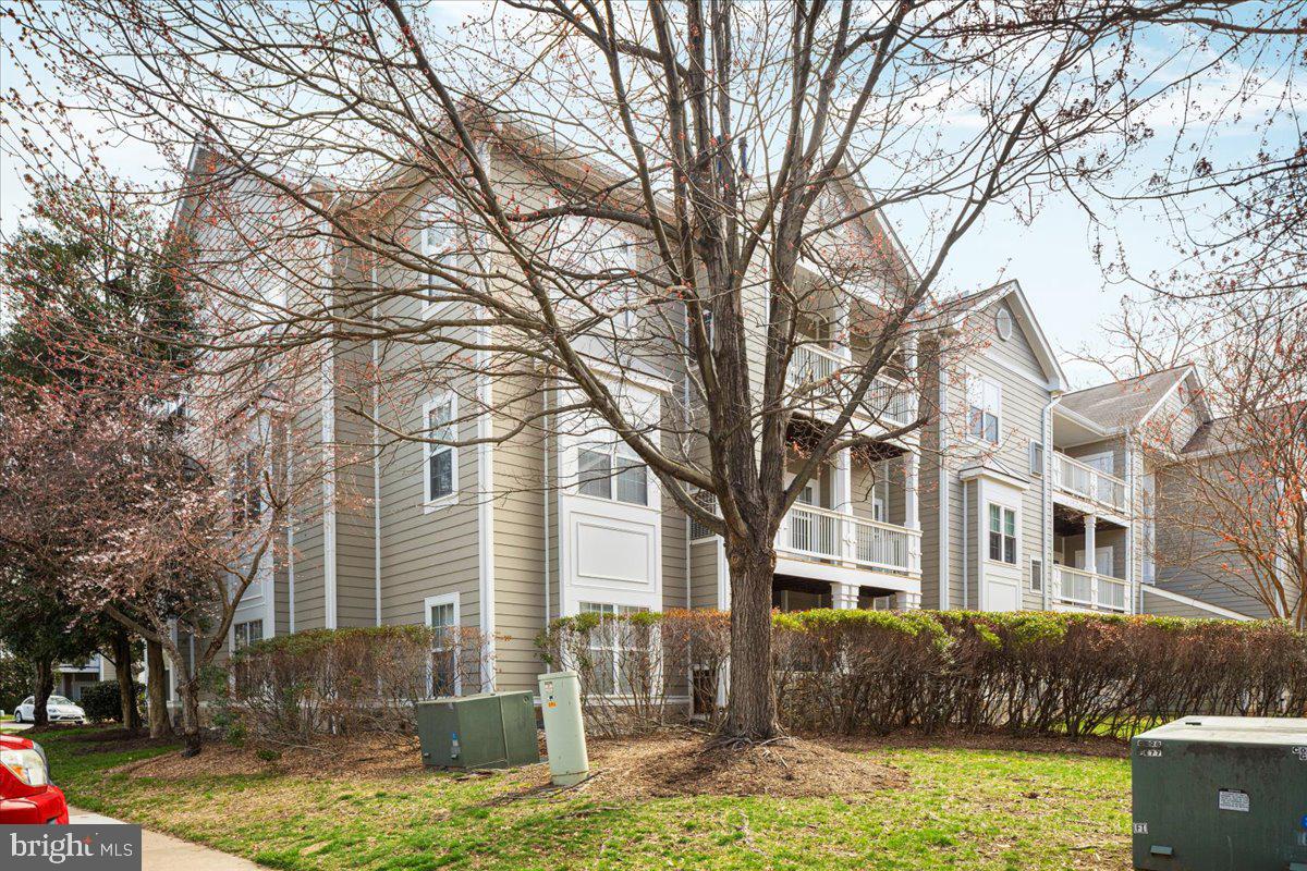 1705 Lake Shore Crest Drive, Unit 25 Reston, VA 20190 - Photo 27 of 31 a front view of a house with garden