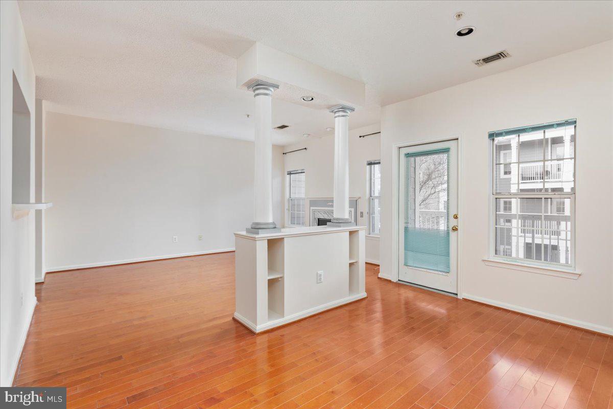 1705 Lake Shore Crest Drive, Unit 25 Reston, VA 20190 - Photo 4 of 31 a view of a kitchen with a sink dishwasher and a fireplace