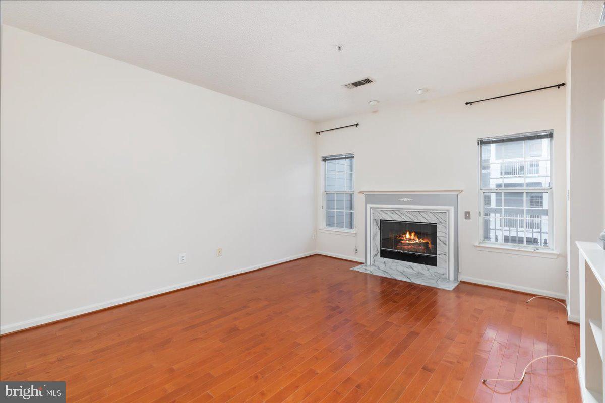 1705 Lake Shore Crest Drive, Unit 25 Reston, VA 20190 - Photo 7 of 31 a view of empty room with a fireplace