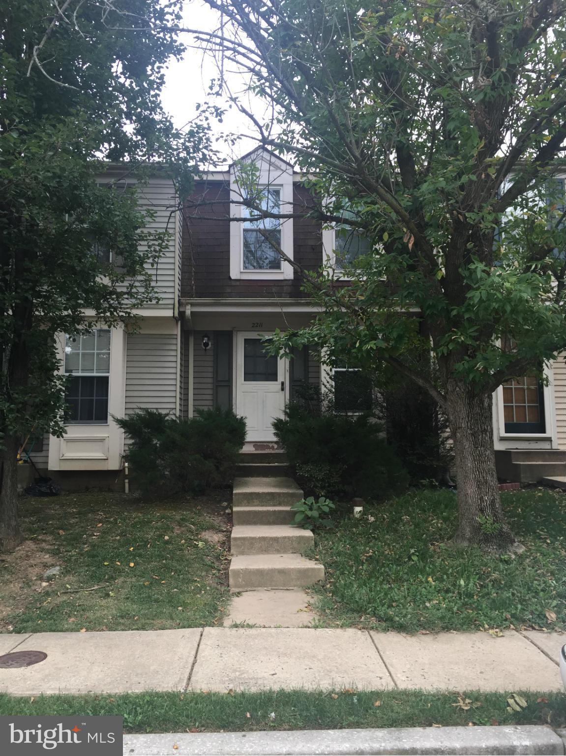 2211 Riding Crop Way Baltimore, MD 21244 - Photo 1 of 20 a front view of a house with a yard