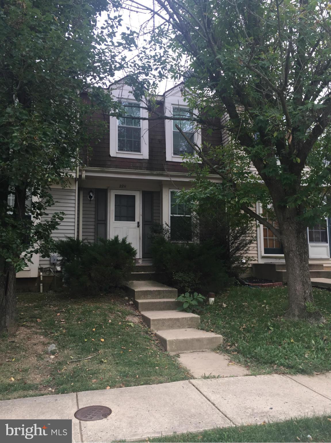 2211 Riding Crop Way Baltimore, MD 21244 - Photo 2 of 20 a front view of a house with garden