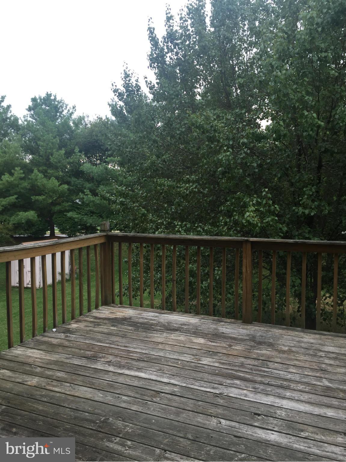 2211 Riding Crop Way Baltimore, MD 21244 - Photo 11 of 20 a balcony with trees in front of it