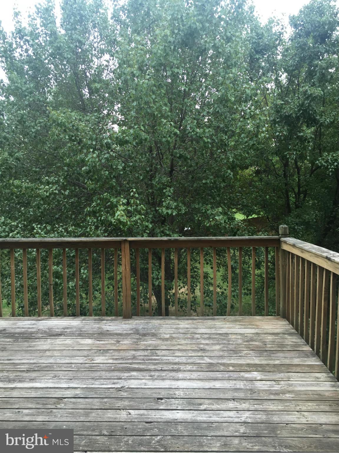 2211 Riding Crop Way Baltimore, MD 21244 - Photo 12 of 20 a view of balcony and wooden floor