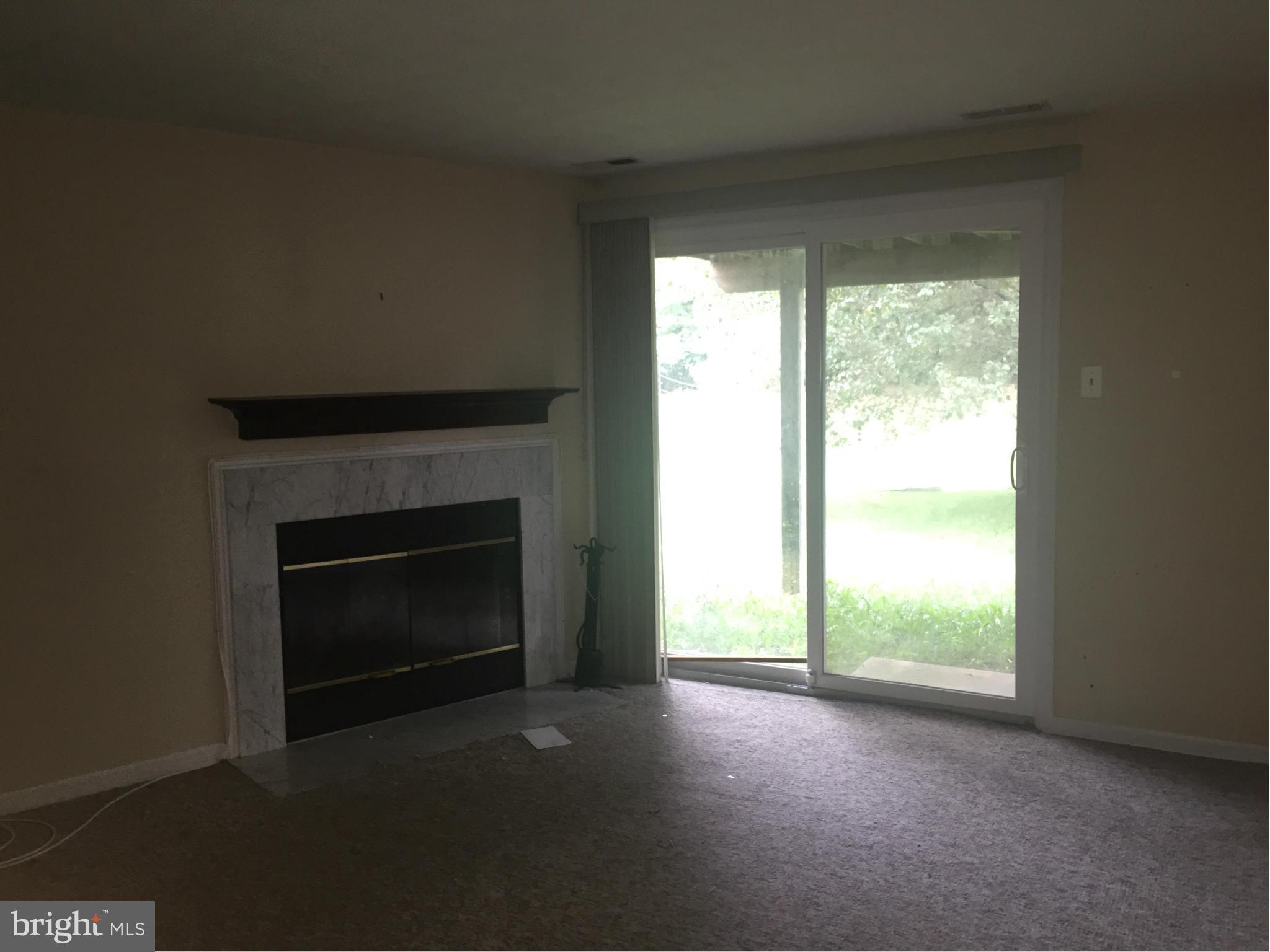 2211 Riding Crop Way Baltimore, MD 21244 - Photo 18 of 20 a view of empty room with a fireplace