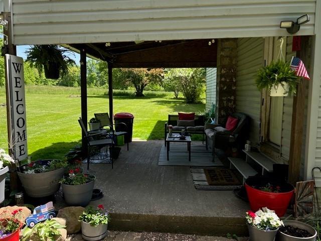 31 Schiestle Road Mercer, PA 16137 - Photo 4 of 22 a building outdoor space with furniture and potted plants