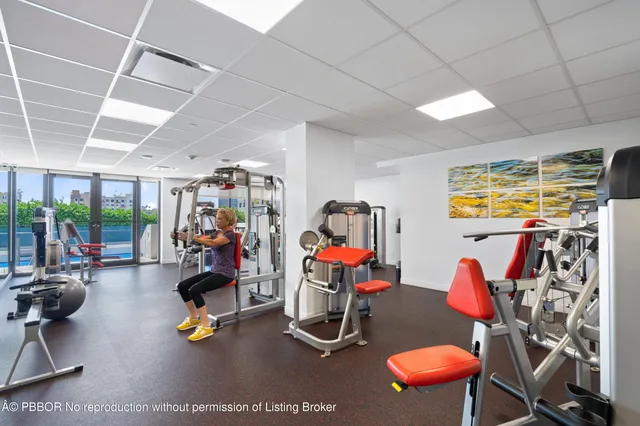 a view of swimming pool with outdoor seating and city view
