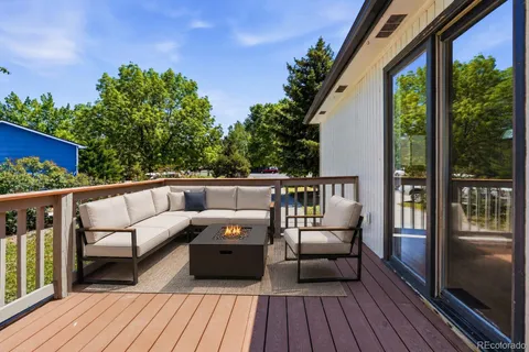 a view of a wooden deck with furniture
