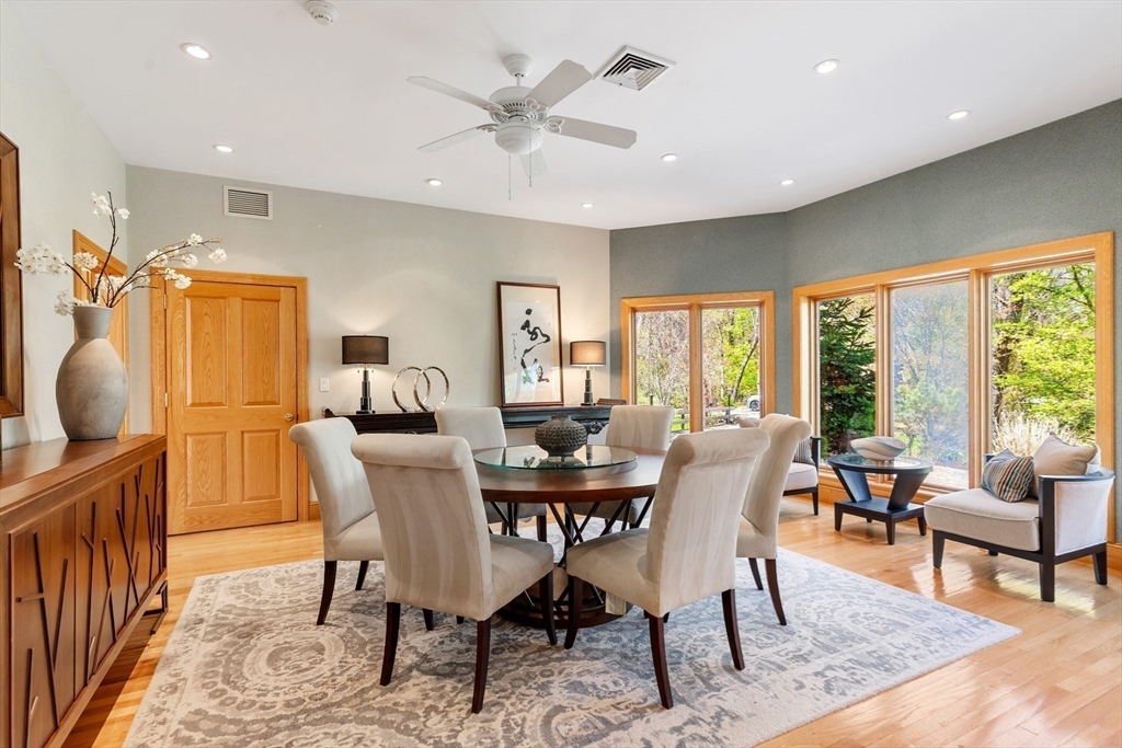 16 Solomon Pierce Road Lexington, MA 02420 - Photo 16 of 42 a dining room with furniture a rug and a floor to ceiling window