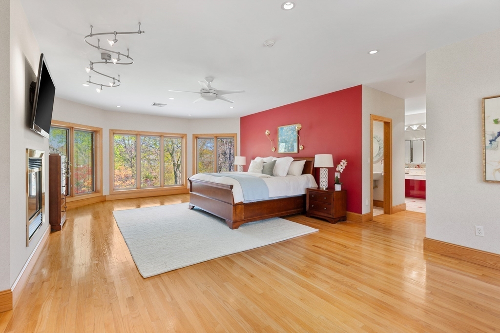 16 Solomon Pierce Road Lexington, MA 02420 - Photo 25 of 42 a spacious bedroom with a bed and window