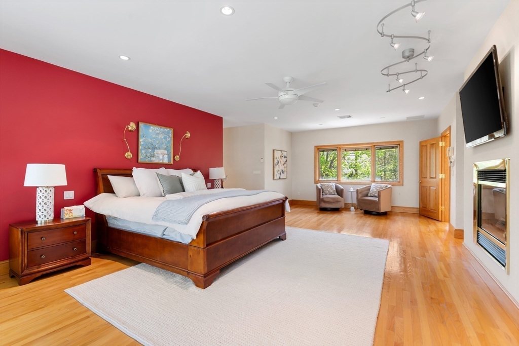 16 Solomon Pierce Road Lexington, MA 02420 - Photo 26 of 42 a spacious bedroom with a bed and a flat screen television