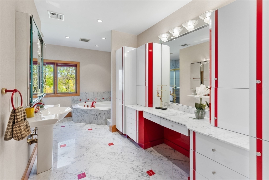 16 Solomon Pierce Road Lexington, MA 02420 - Photo 27 of 42 a bathroom with a bathtub sink vanity and mirror