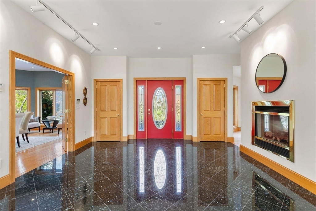 16 Solomon Pierce Road Lexington, MA 02420 - Photo 10 of 42 an entryway with a dining room and livingroom view