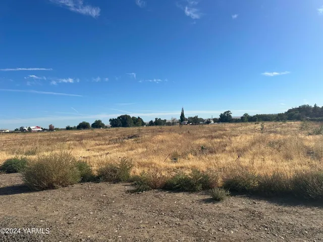 a view of lake with green space