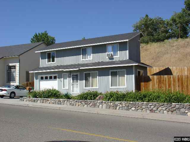 2430 Keystone Avenue Reno, NV 89503 - Photo 1 of 1 a front view of a house with a yard and a garage